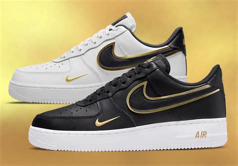 white Nike's with gold swoosh